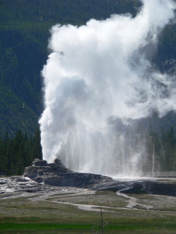 Castle Geyser erupting in the distance